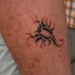 Joe's scorpion tattoo.