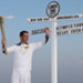 Torchbearer and three-time Olympic gold medallist Ben Ainslie holds the torch and waves to the crowd before he begins the first leg between Land's End and Sennon. Picture: LOCOG