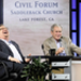 Pastor Rick Warren, left, laughs as former President George W. Bush speaks during an appearance at Saddleback Church in Lake Forest