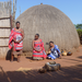 Our guide and the chief's daughter inside a traditional Swazi homestead.