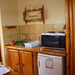Efficiency kitchen from our self-catering studio in Wilderness. That stove-top really works. I was able to cook a meal of chicken, rice and cabbage on those two burners.