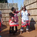 Dancing with the chief. She moves my hat so my face can be seen more clearly.
