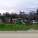 High on the hill away from the ocean views are these dwellings where Africans live.