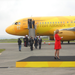 Olympic torch - Olympic Committee get off the plane.jpg