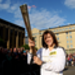 Raquel Matos holds the Olympic Flame in Edinburgh at the beginning of Day 27 of the London 2012 Olympic Torch Relay.