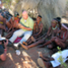 Andrew sits with the Bushmen of the Kalahari