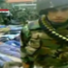 Screen grab of Syrian soldier in front of cuffed protesters