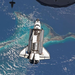 Atlantis in orbit with it bay doors open on its last mission.