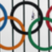 Bear Grylls seen through the giant Olympic Rings on the Tyne Bridge. He carried the Torch on a zip wire from the Tyne Bridge to the Quayside below, watched by thousands of people along the banks of the River Tyne. Picture: LOCOG